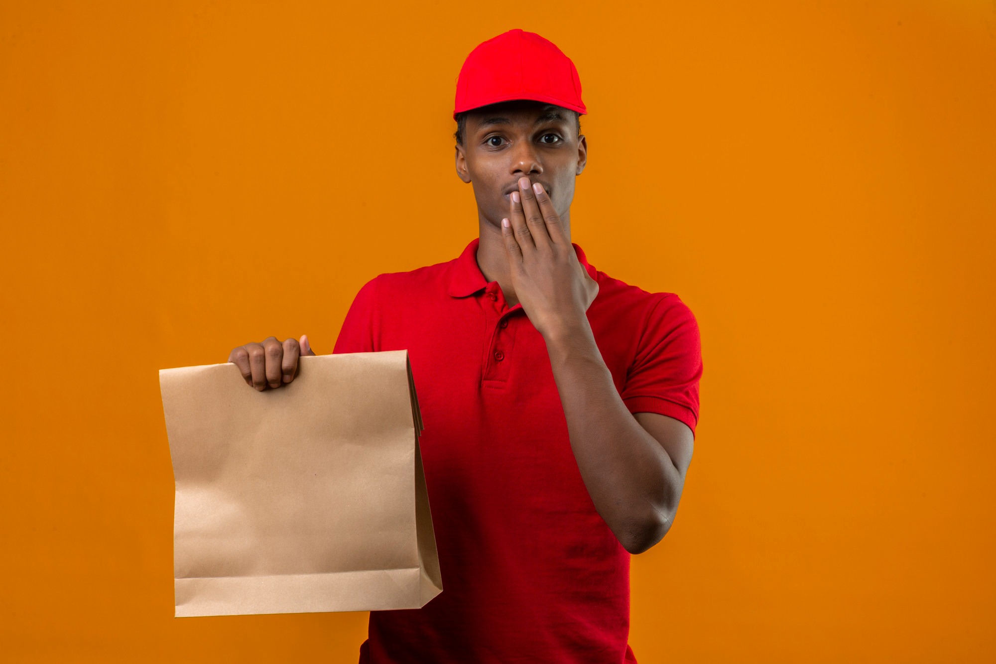 Professional Kera Rider posing with his motorbike and delivery gear